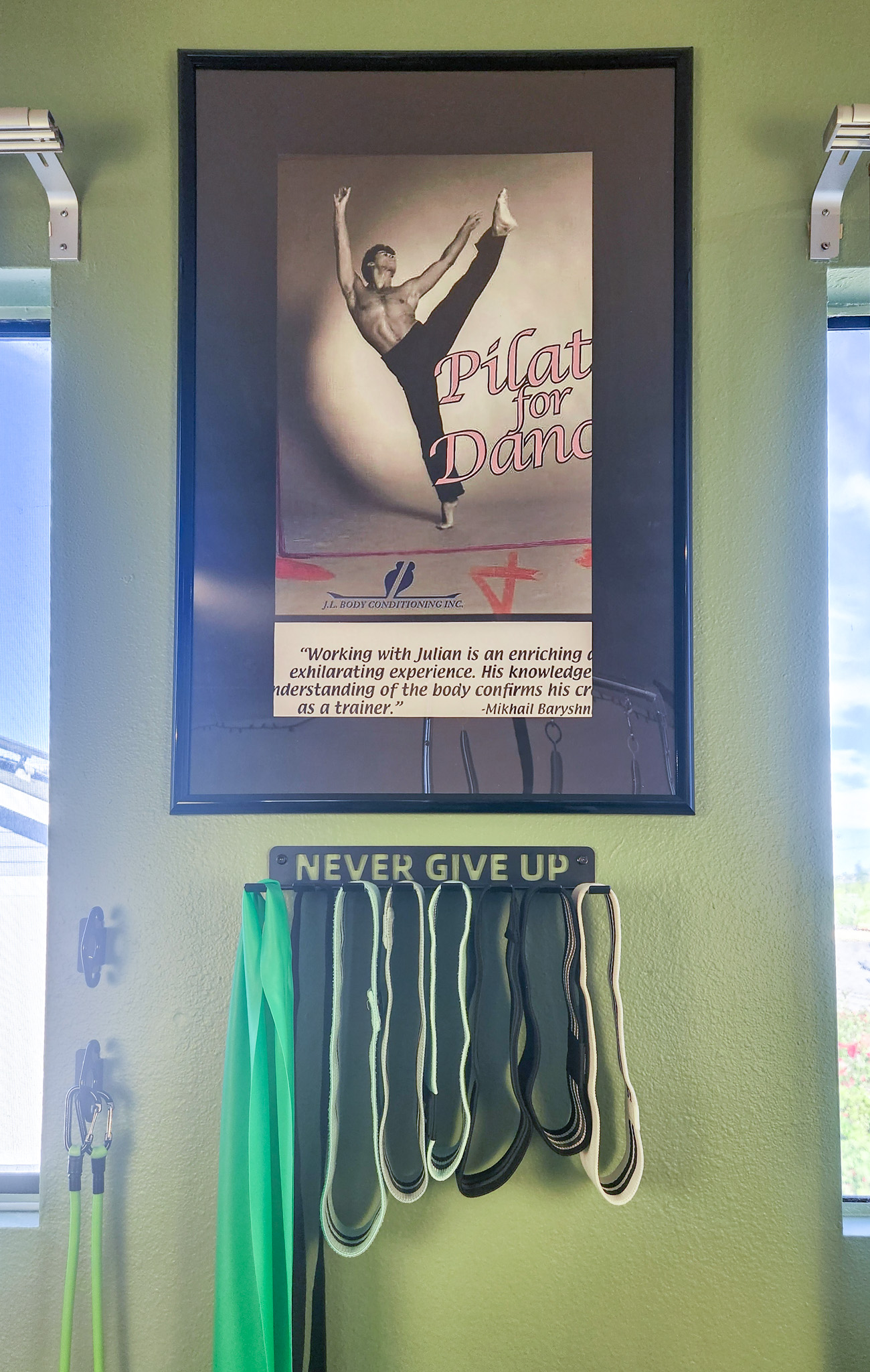 Julian Littleford Pilates poster displayed inside the Fit Monkeys studio.
